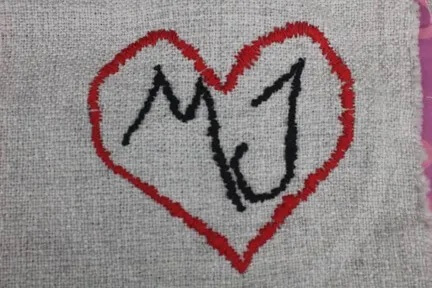 Mj initials inside heart embroidery